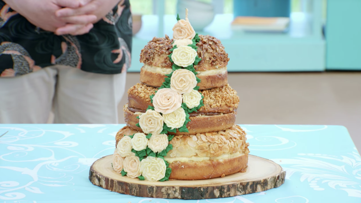 Crystelle&#x27;s cake, with a climbing flower decoration across all three tiers