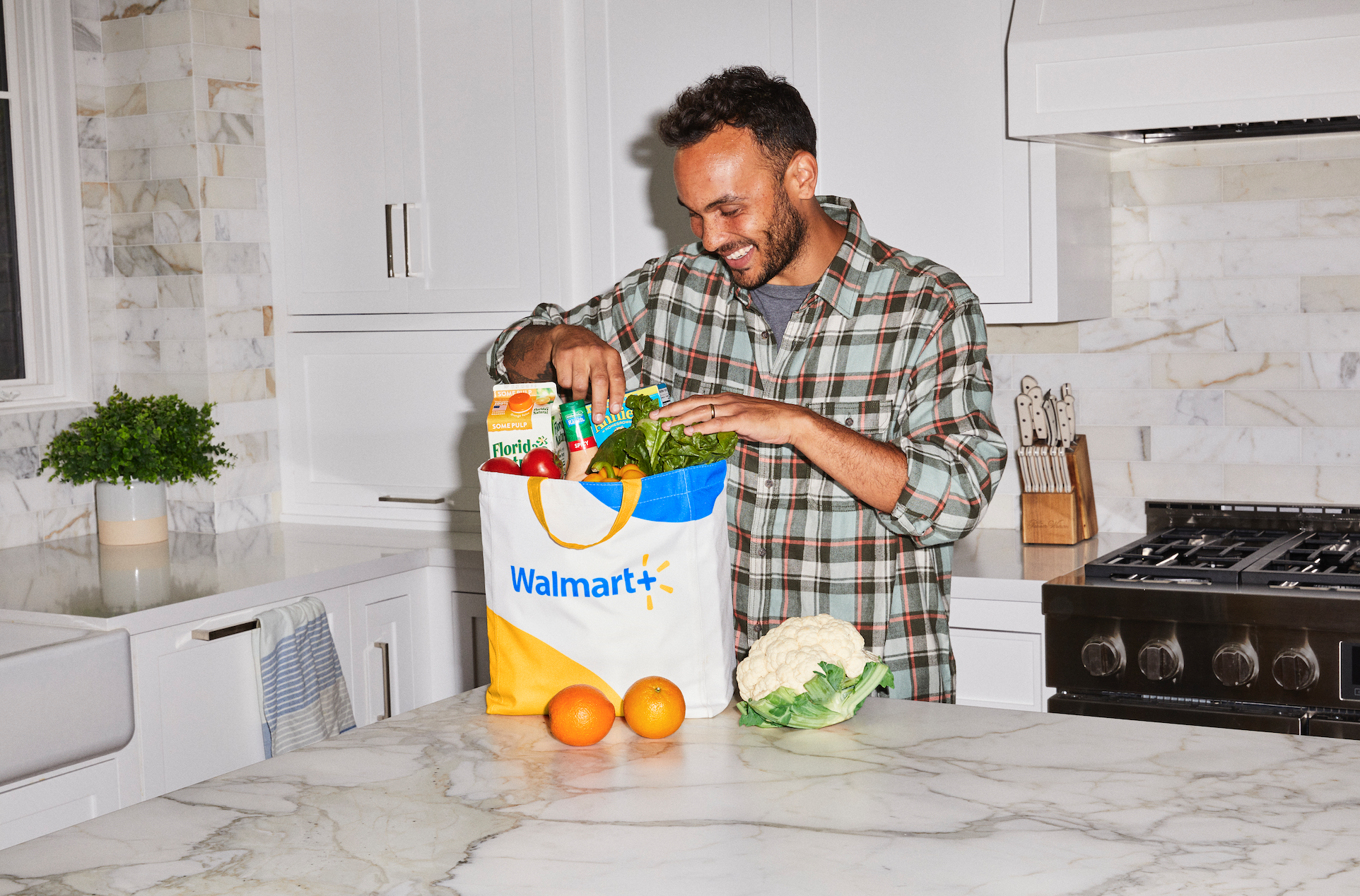 Man unpacking a Walmart grocery bag