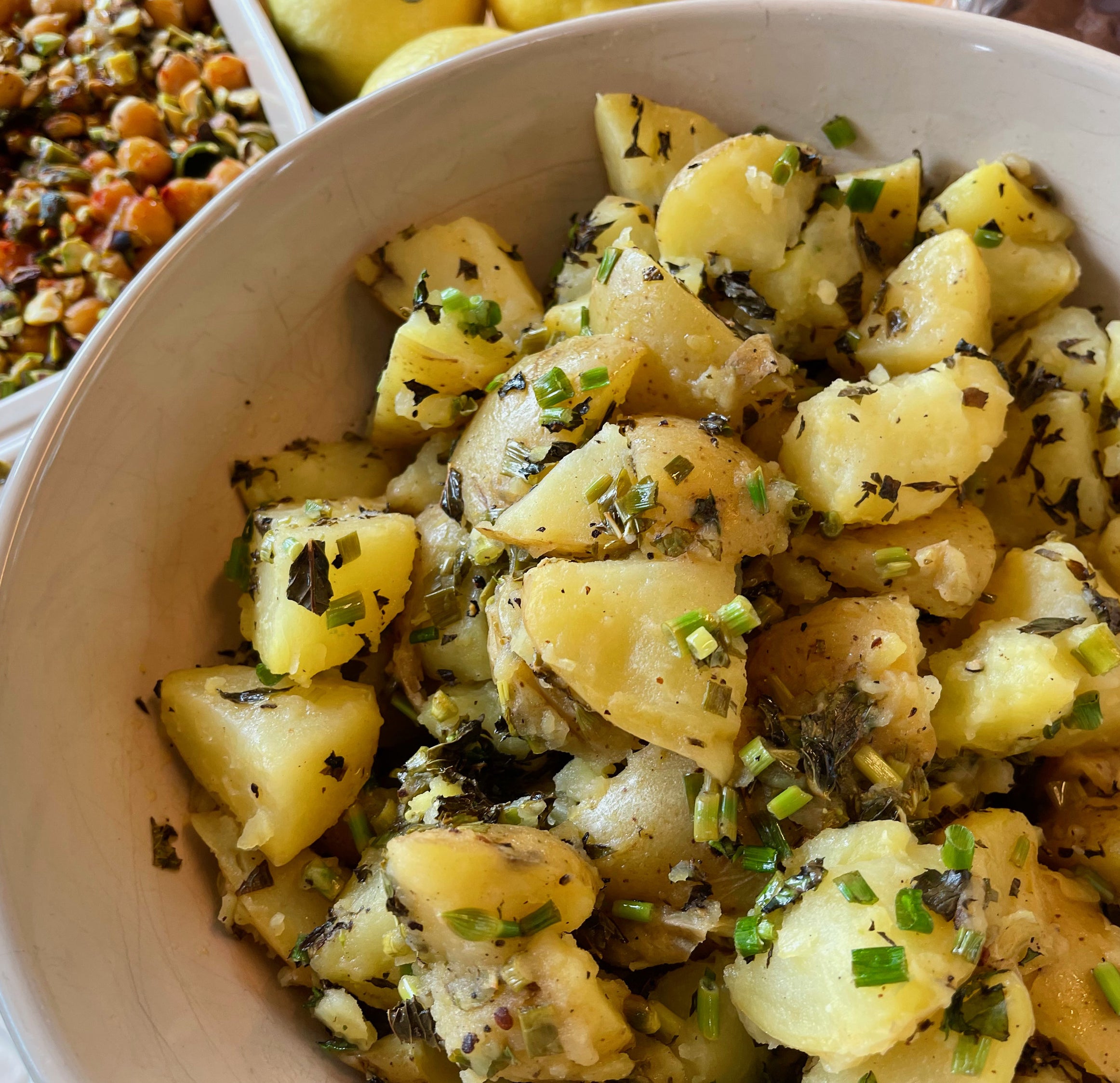 german potato salad with fresh chives in a bowl