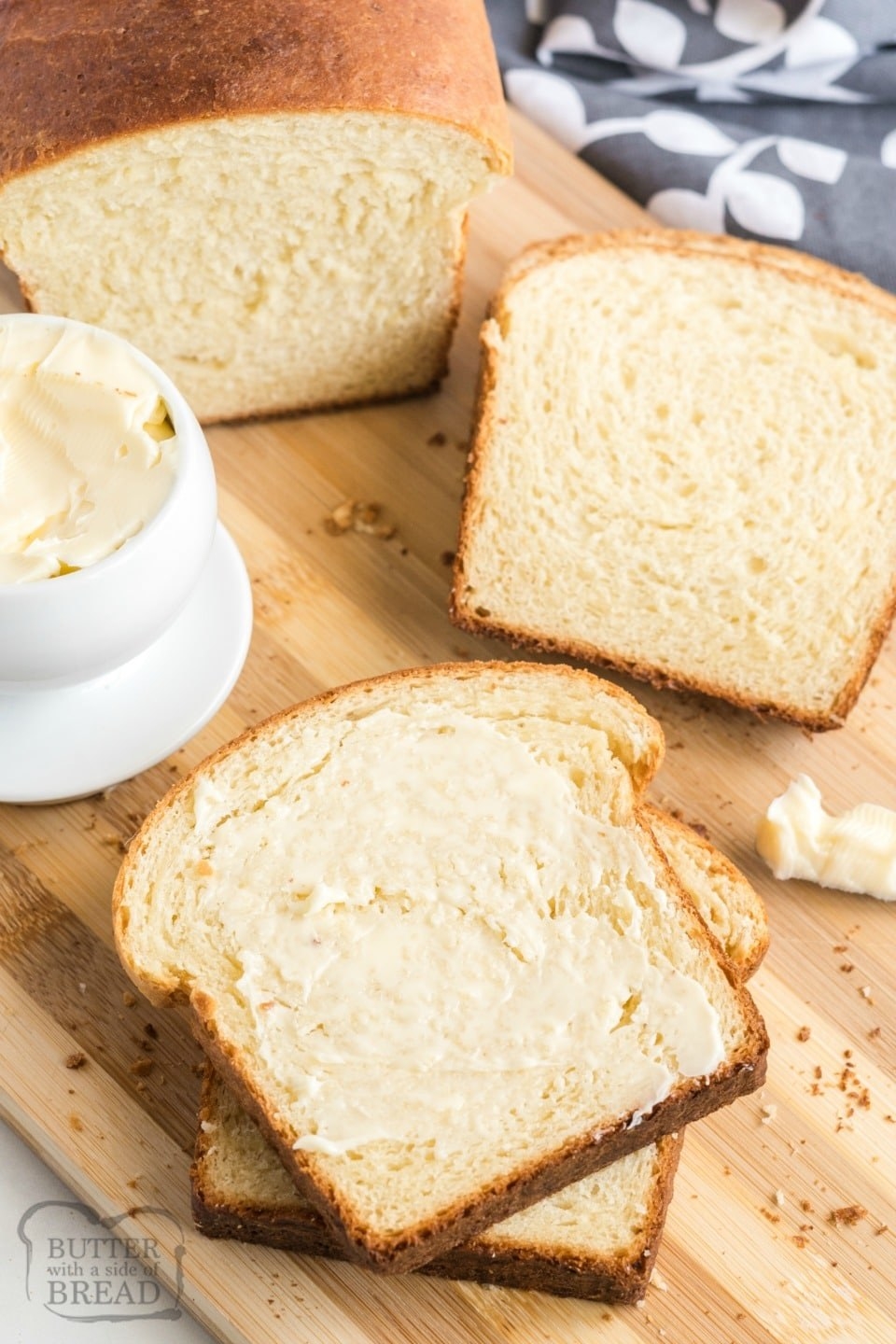 Sliced potato bread slathered in butter