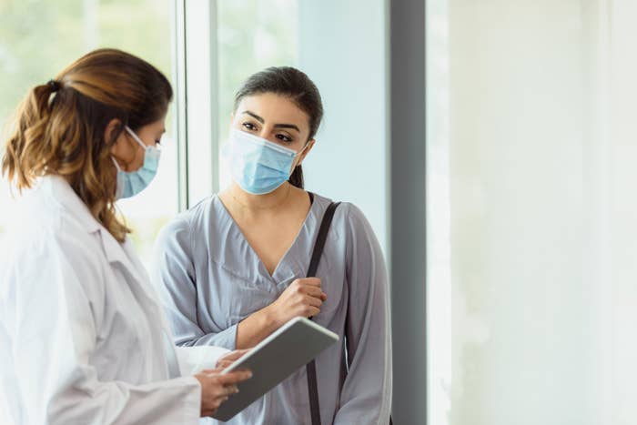 A woman talking to a doctor