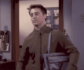 Joey from &quot;Friends&quot; wearing a bag on his shoulder and flexing