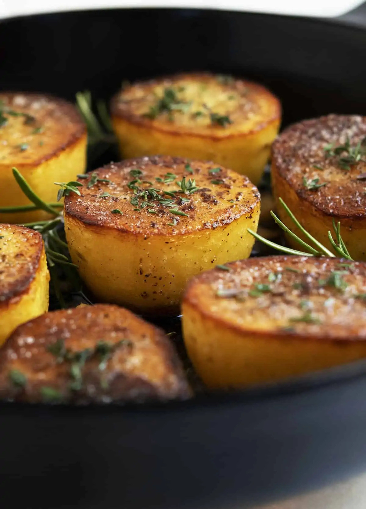 Fondant potatoes in a cast iron skillet