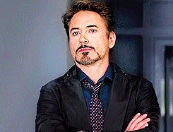 Robert Downey Jr. rolling his eyes with his arms crossed