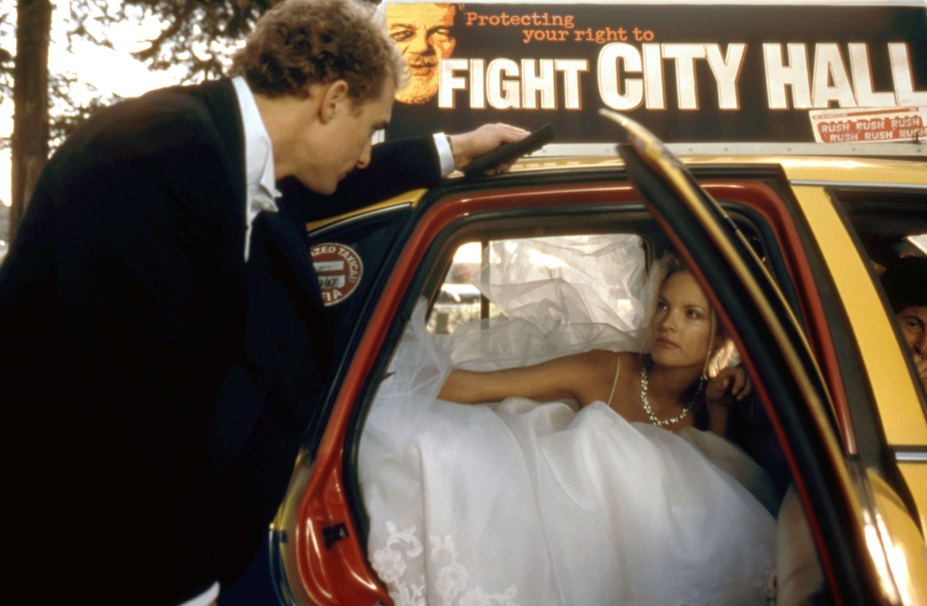 Steve walks Fran to a taxi in her wedding dress