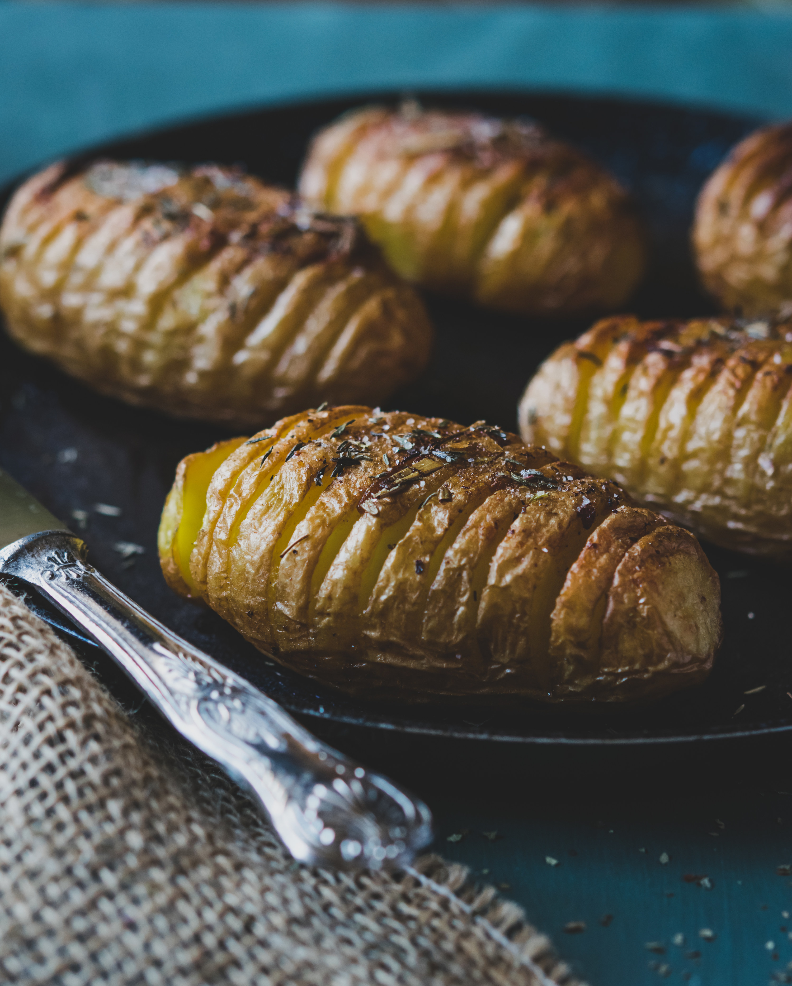 hasselback potatos served on a platter