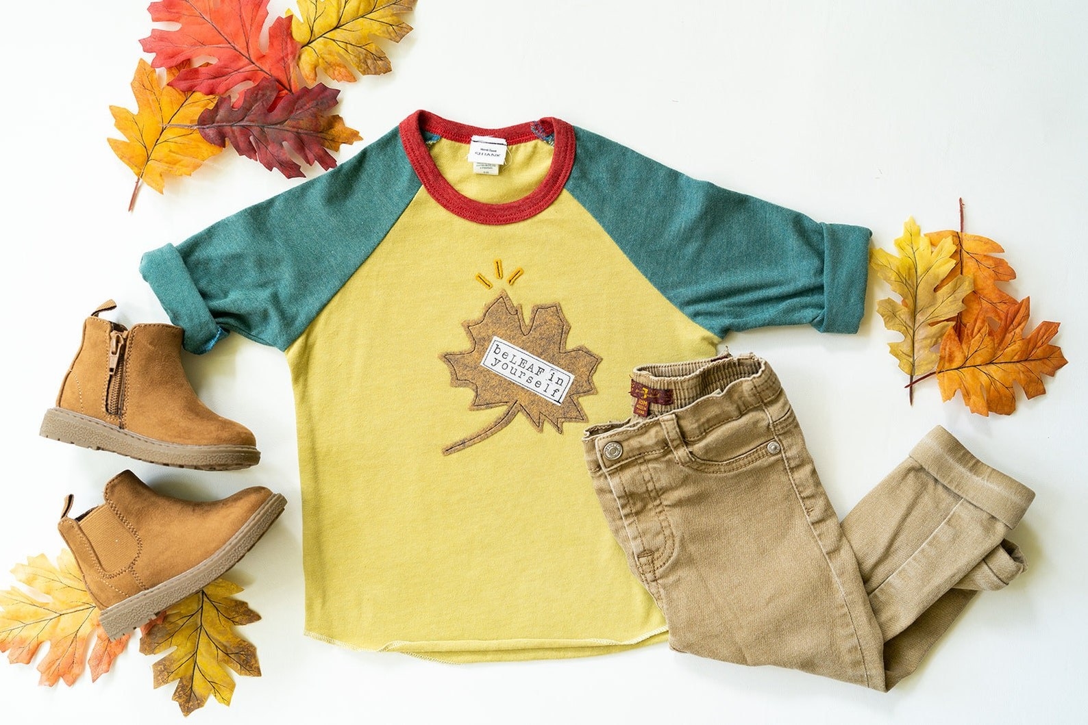 A child-sized shirt with a leaf and text that says, &quot;beleaf in yourself&quot;