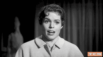 Woman screaming in a black-and-white movie