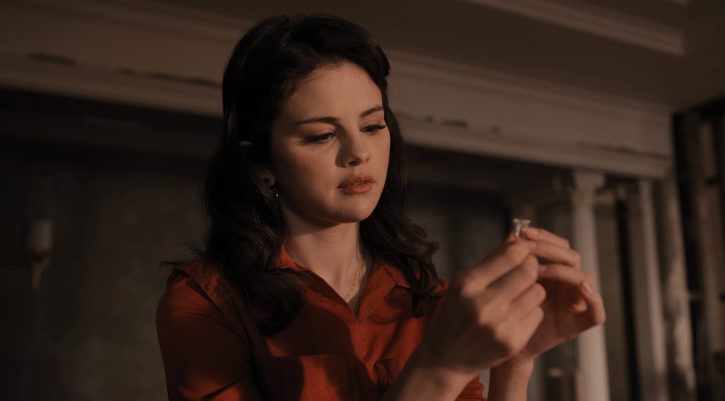 Photo of Selena Gomez as Mabel in a plaid shirt and a peach eyeshadow