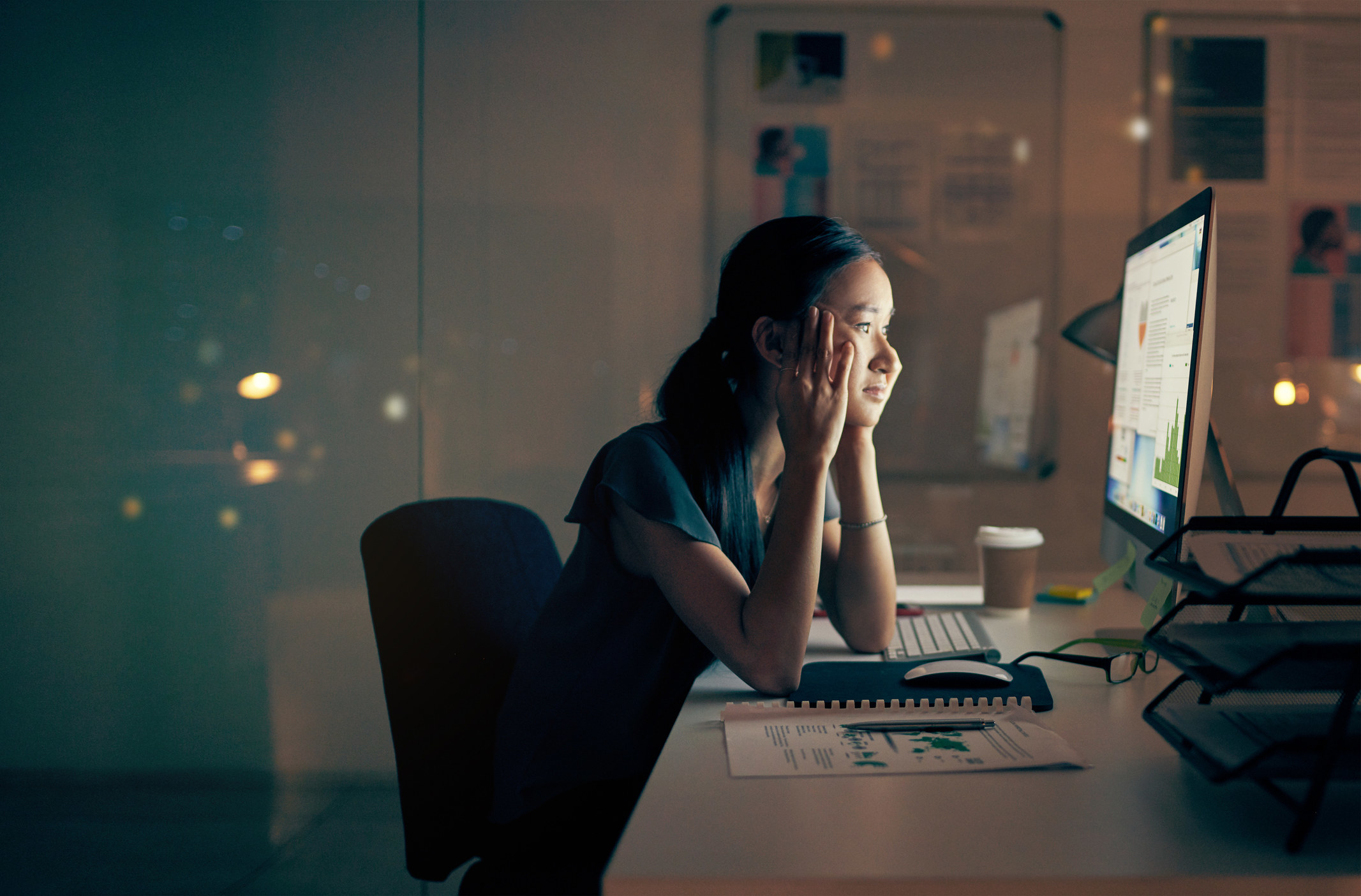 A woman who looks tired of staring at her screen