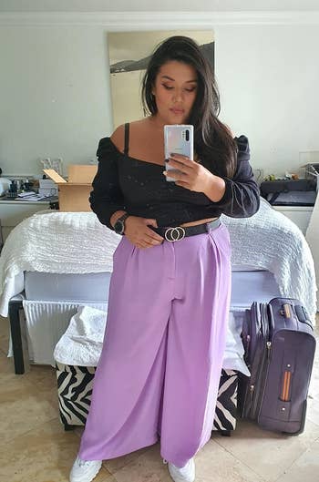 Reviewer wearing the pants in lilac with a black belt