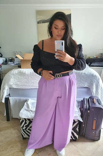 Reviewer wearing the pants in lilac with a black belt