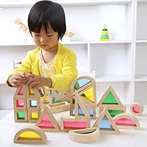 A child playing with the rainbow blocks