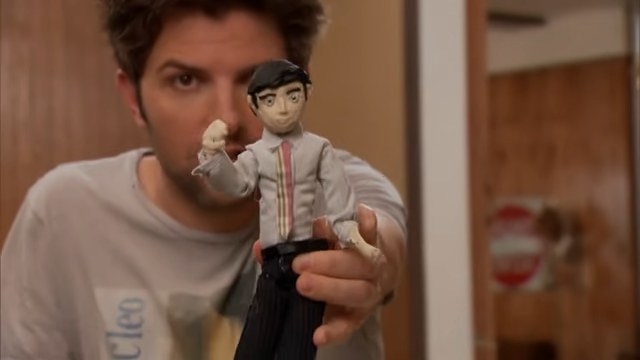 Ben holding a clay doll in &quot;Parks and Recreation&quot;