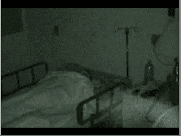 Ghostly figure moving through what looks to be a hospital room