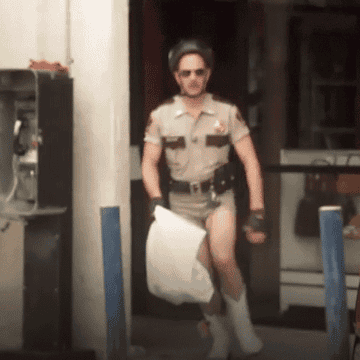 gif of someone jumping out of a store with new white cowboy boots on