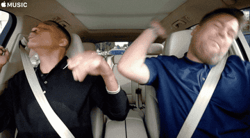 Will Smith sat in a car with James Cordon Singing and dancing.