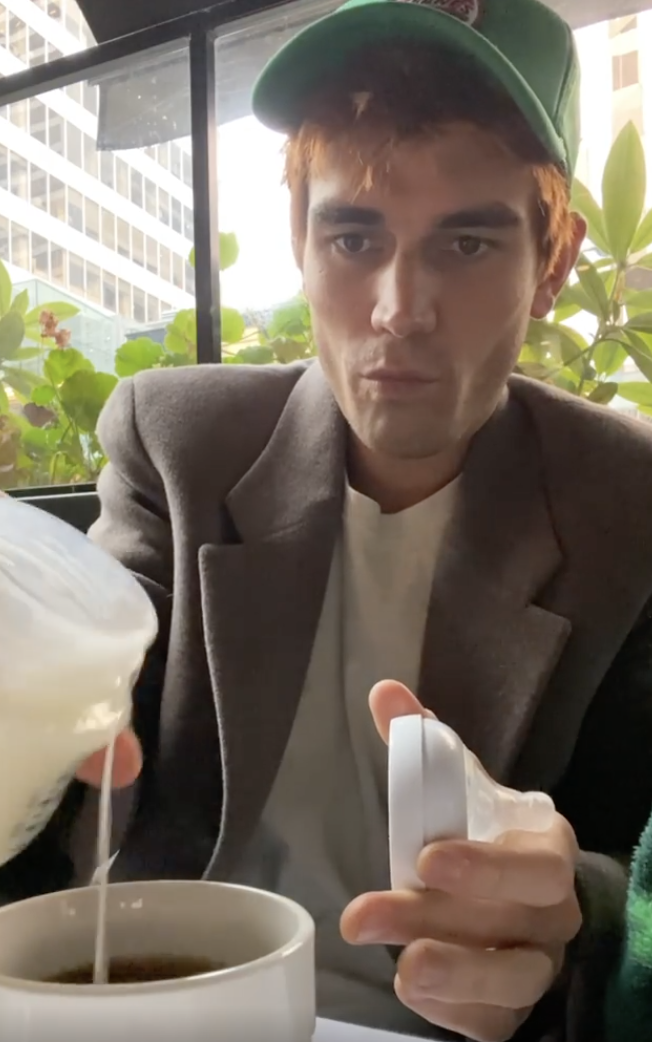 KJ pouring breast milk into his coffee