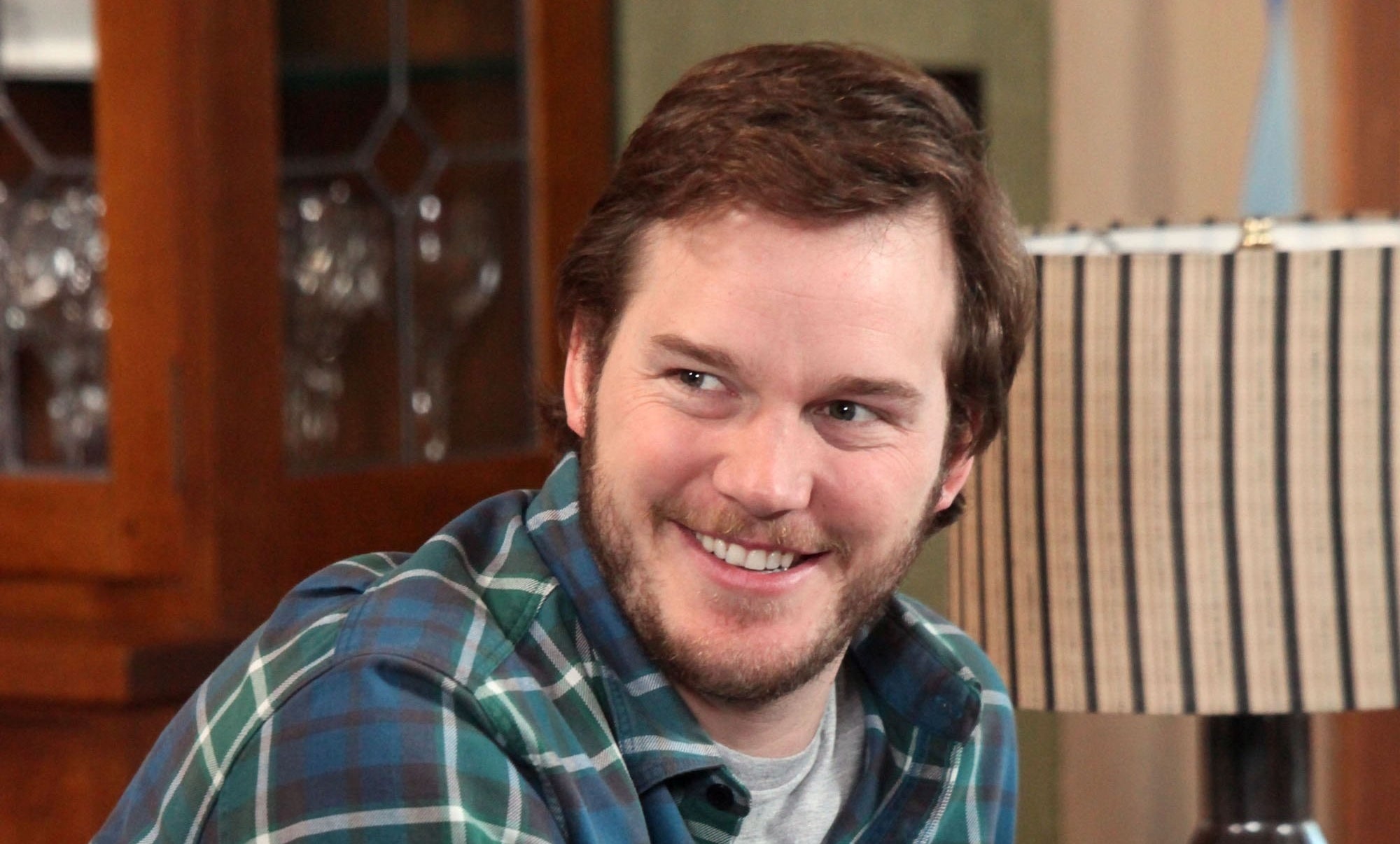Andy smiling in a green plaid shirt in &quot;Parks and Recreation&quot;