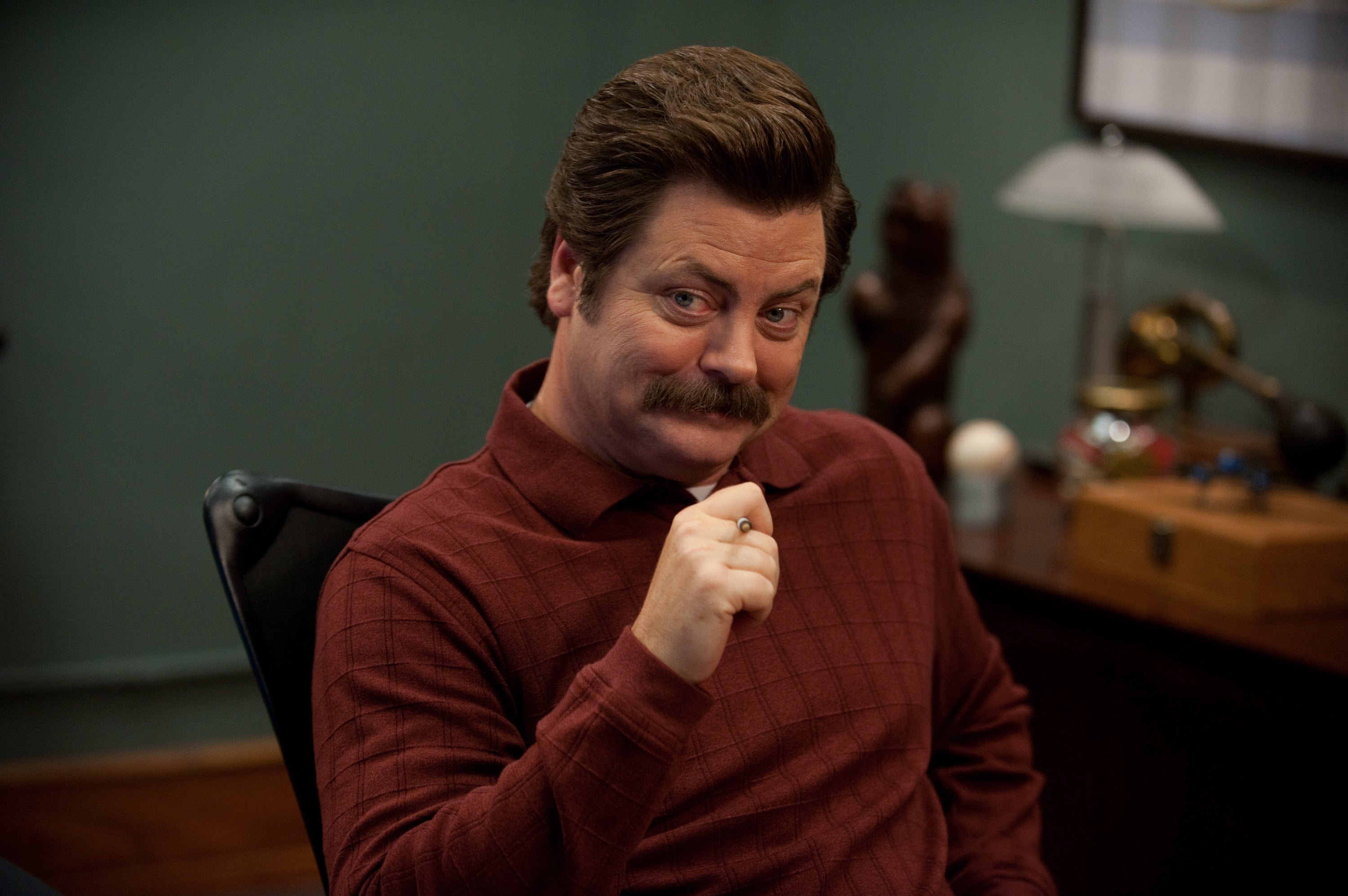 Ron sitting at his desk in &quot;Parks and Recreation&quot;