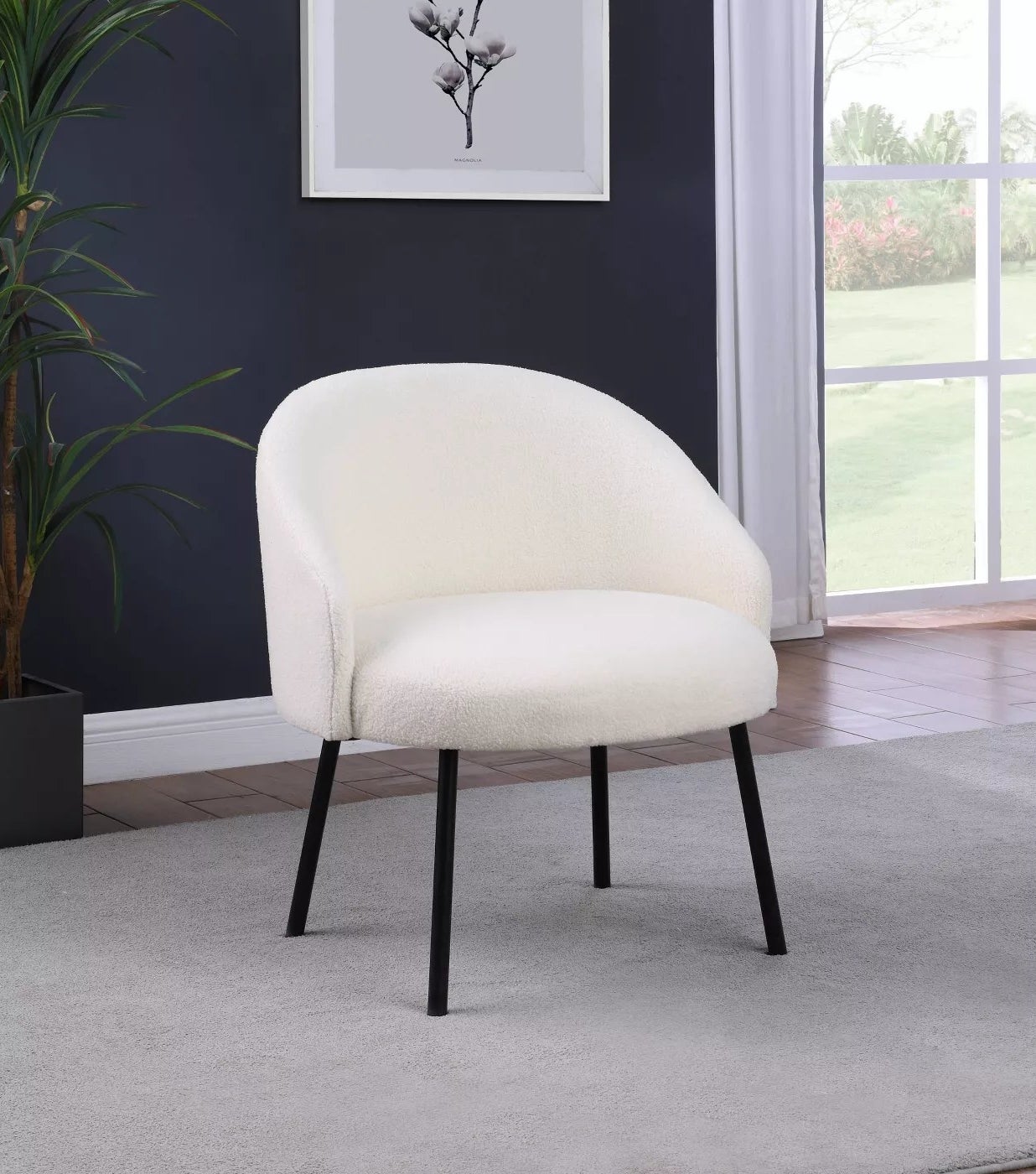 The cream chair with black legs