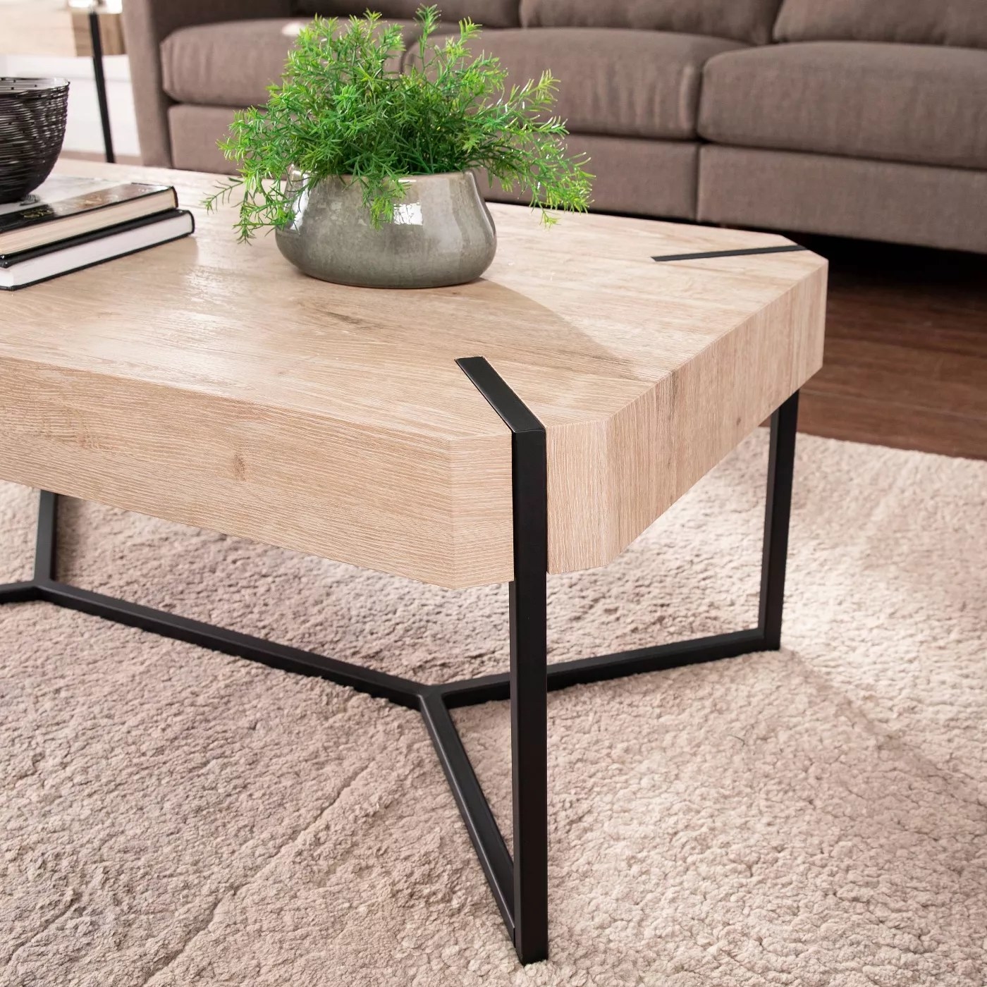 The table with natural wood and a black frame