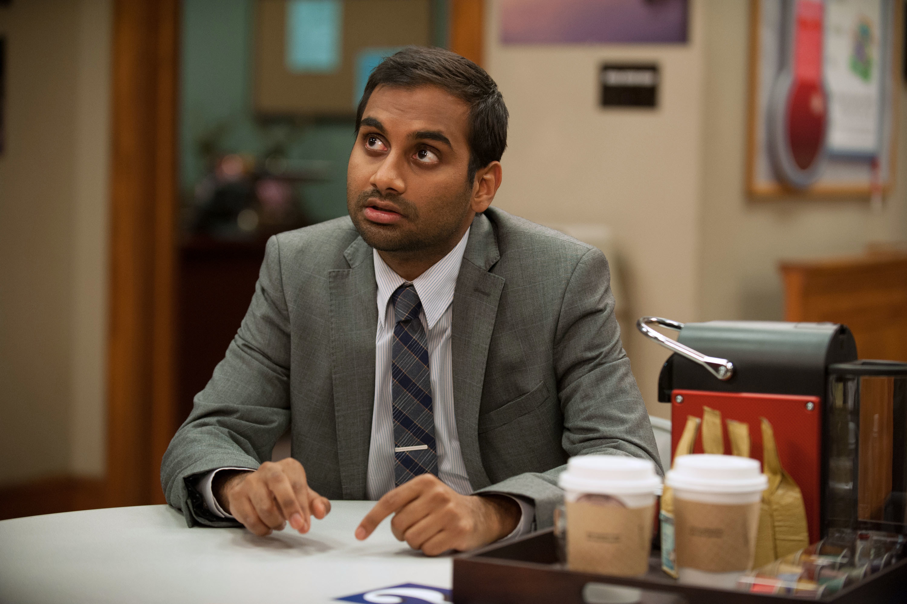 Tom sitting at a table in &quot;Parks and Recreation&quot;