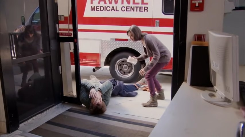 Andy lying hurt in front of an ambulance with April in &quot;Parks and Recreation&quot;