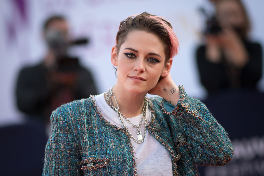 Kristen Stewart poses as she arrives on the red carpet to attend the award ceremony