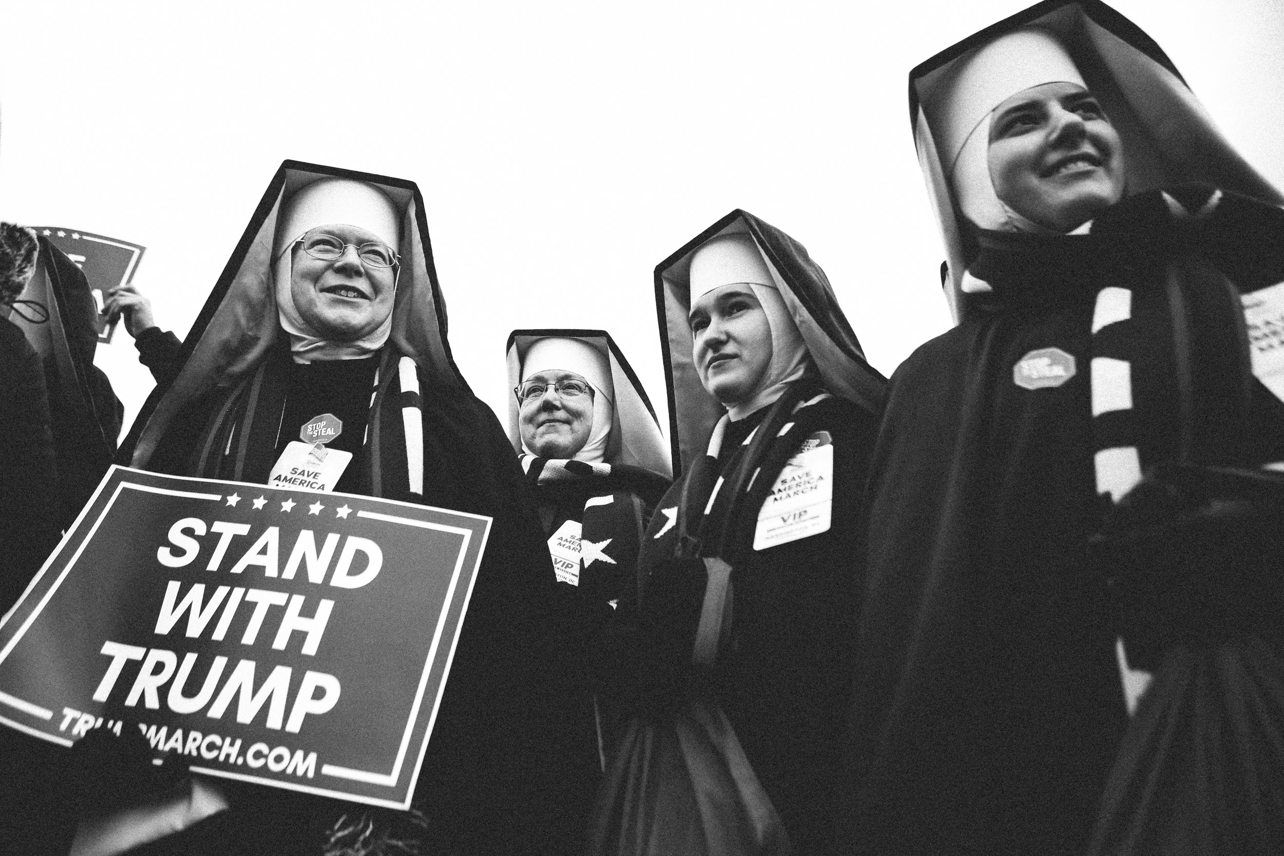 Four nuns in habits, one of them holding a sign that says &quot;stand with trump&quot;