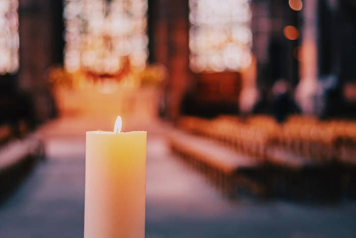 A lit candle in St Lawrence Church in Nuremberg City, Germany