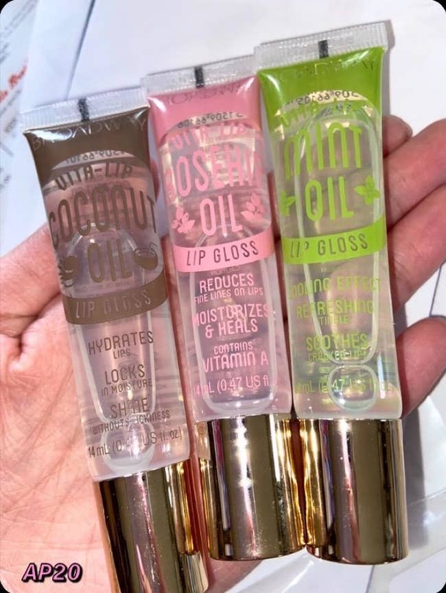 Reviewer holding the three gloss tubes