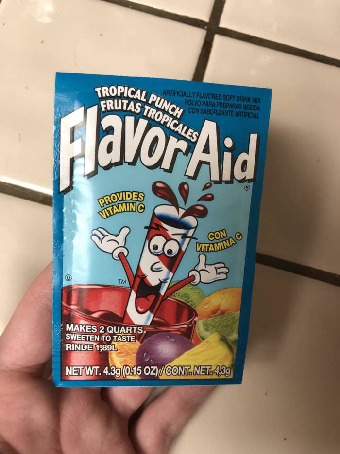 person holding Flavor Aid
