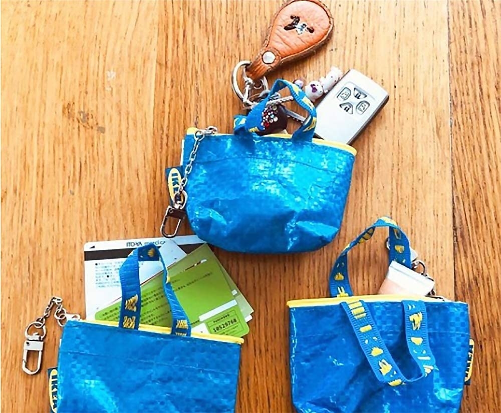 tiny blue ikea bags with credit cards and car keys inside