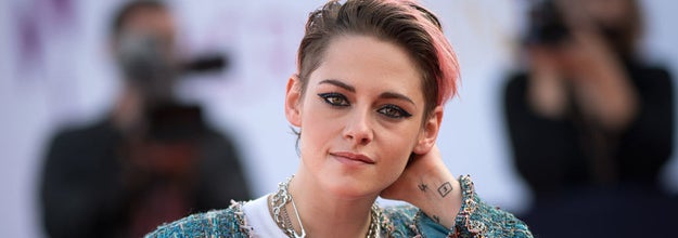 Kristen Stewart poses as she arrives on the red carpet to attend the award ceremony