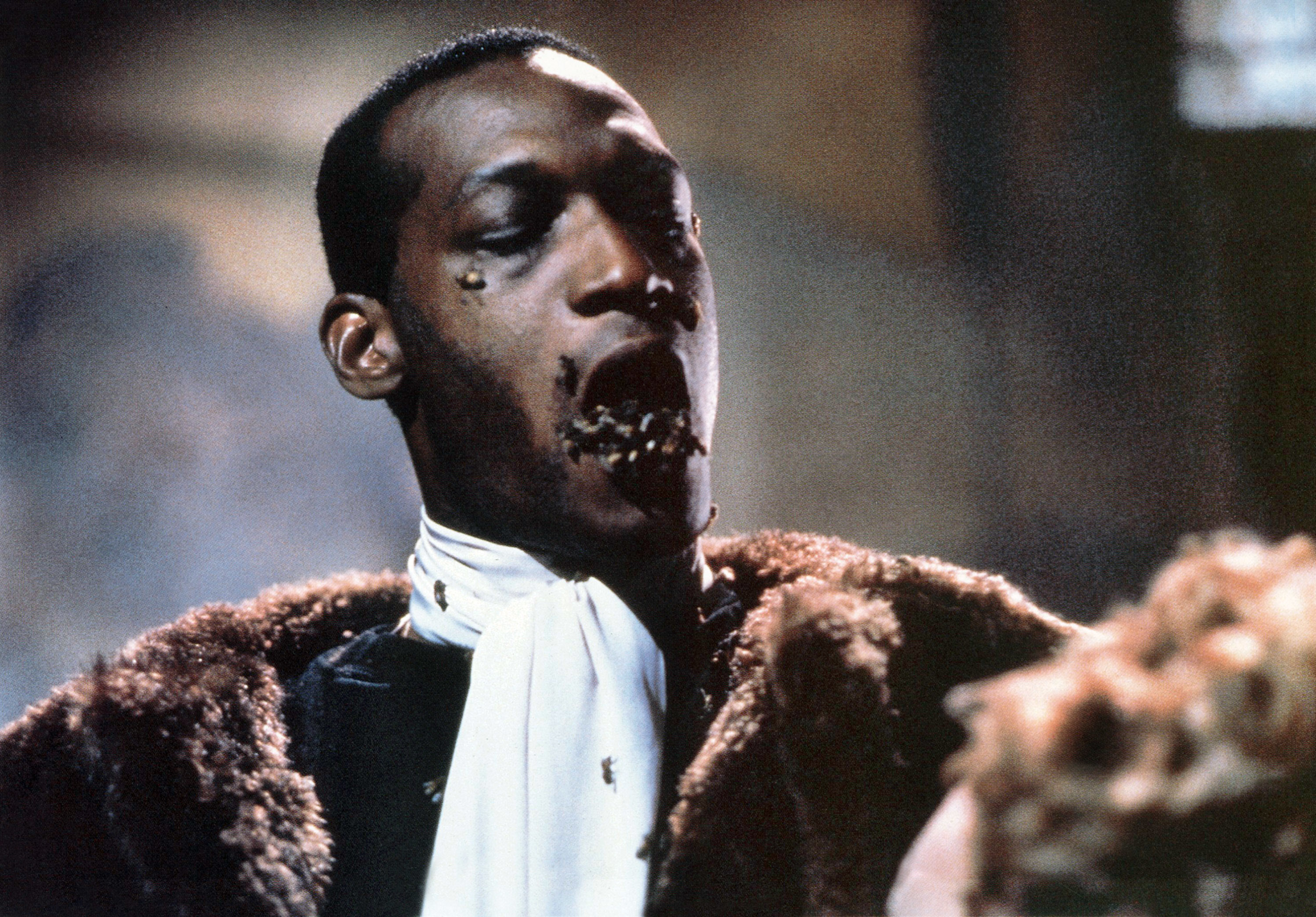 Tony Todd with bees coming out of his mouth