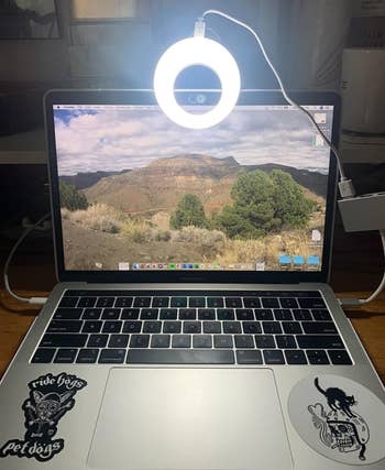 bright light clipped to the top of a laptop