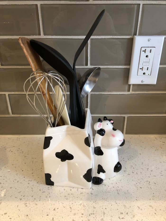reviewer image of cooking utensils inside the cow utensil holder
