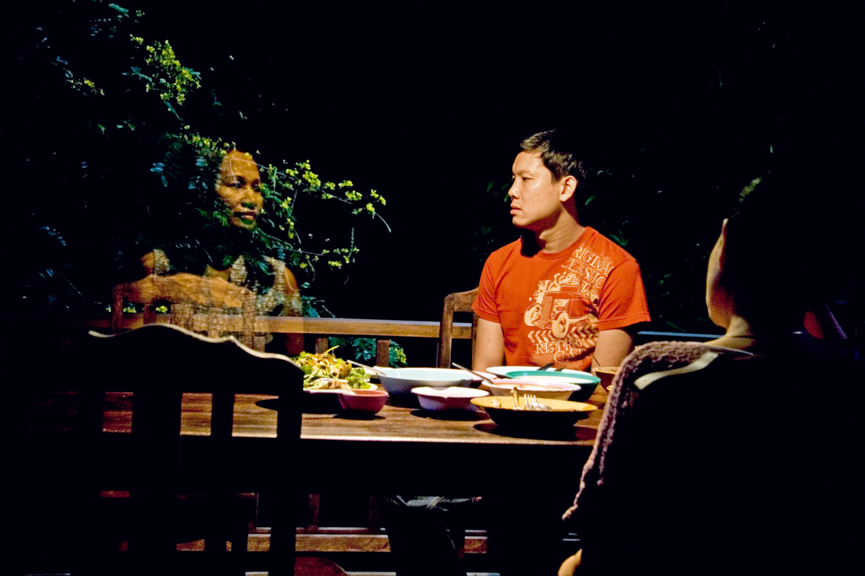 Natthakarn Aphaiwong sits next to Thanapat Saisaymar