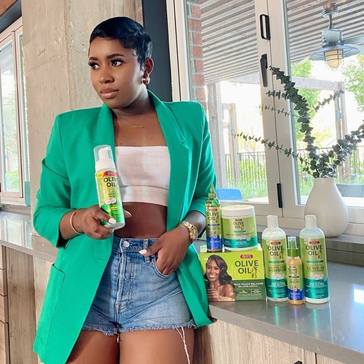 a person holding a bottle of the wrap set mousse