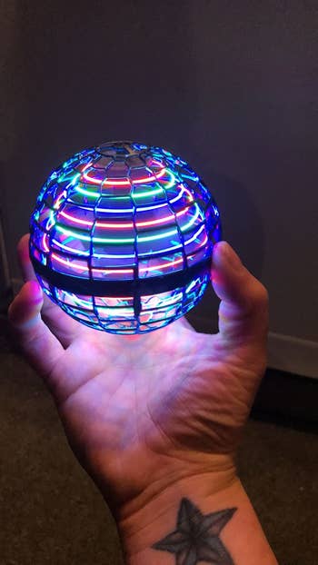 Reviewer holding the lit up ball