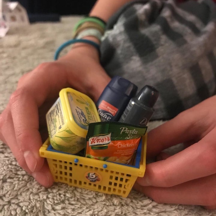 Reviewer's photo showing the mini brand name replicas inside the ball