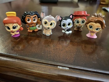 Reviewer's photo showing the collectible figures they received in the mystery box