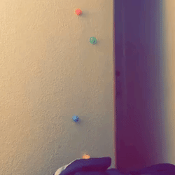 Reviewer's video showing the sticky balls sliding down the wall