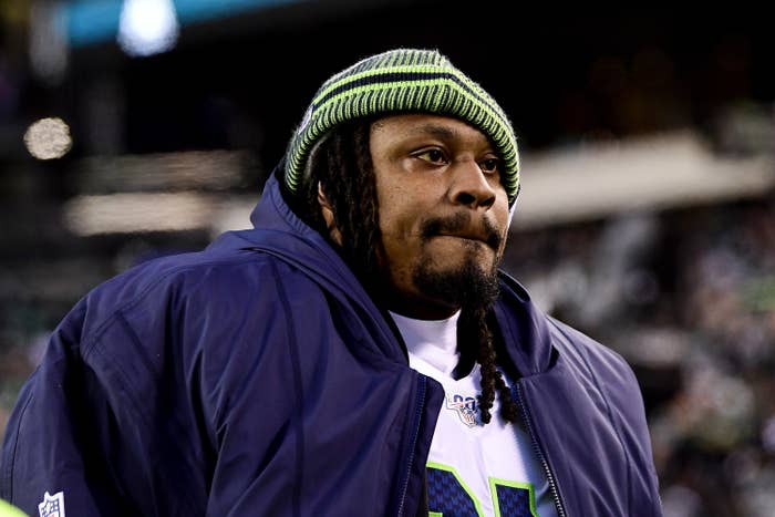 Marshawn Lynch in a Seahawks beanie and jacket