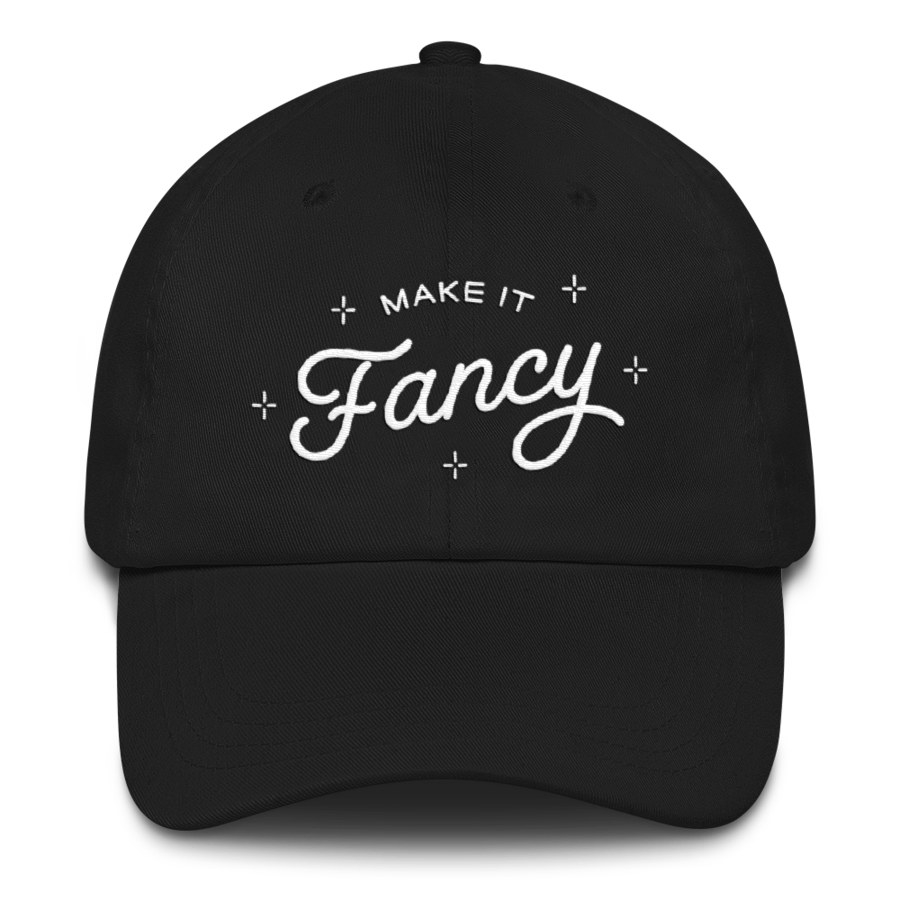 a black hat that says &quot;Make It Fancy&quot;