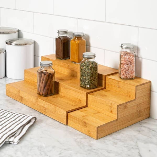 an expandable, three-tier bamboo spice organizer