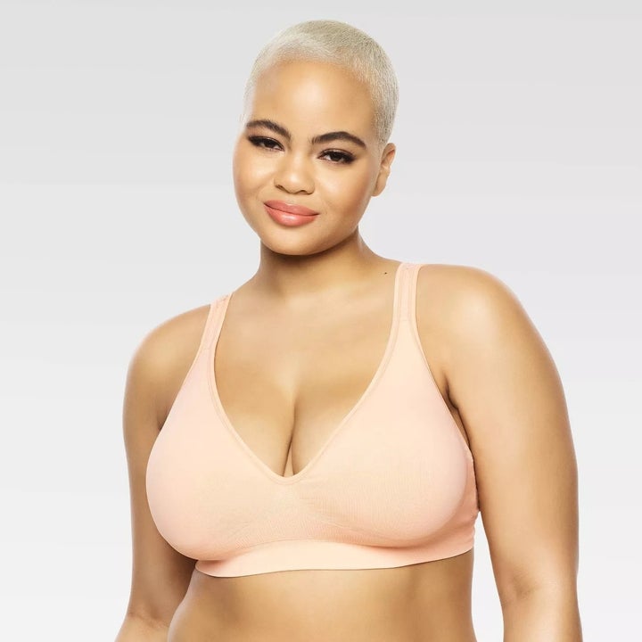 Model wearing cream bralette