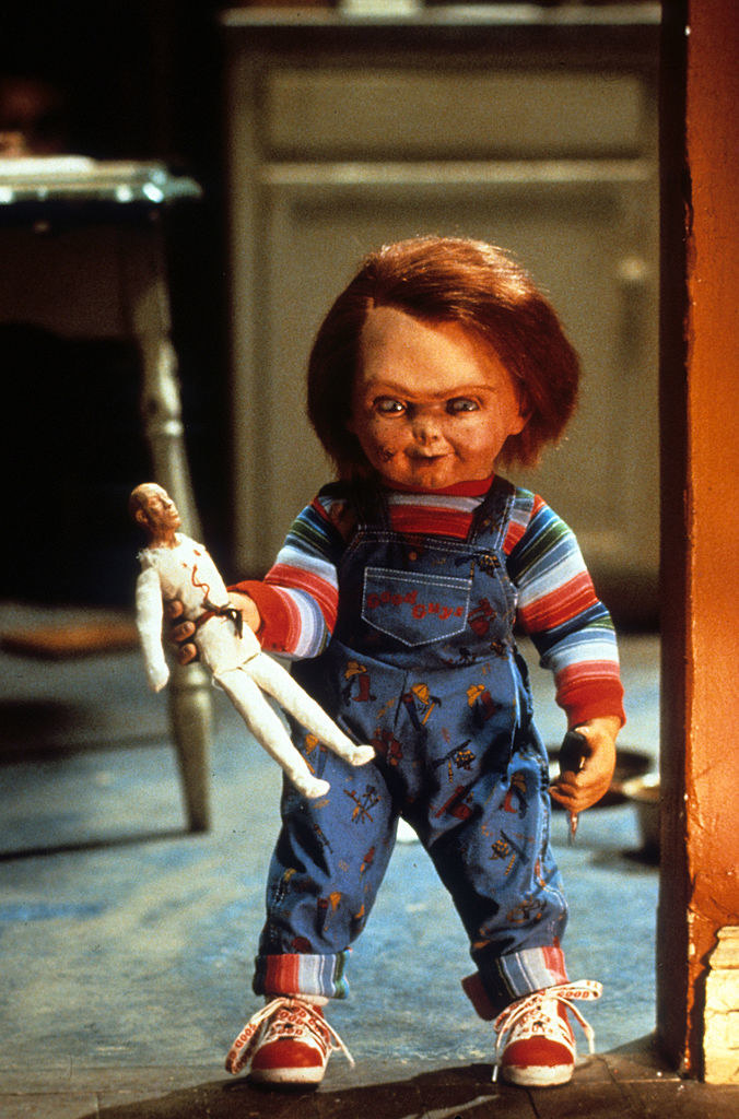 chucky doll holding a doll