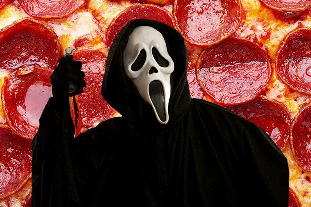 ghost face from scream over a pepperoni pizza background